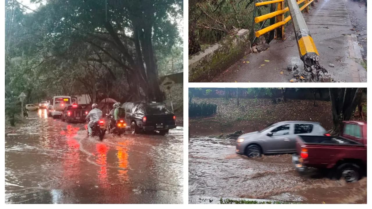 Carros y motos avanzan por vías inundadas de Medellín durante el aguacero del 9 de octubre
