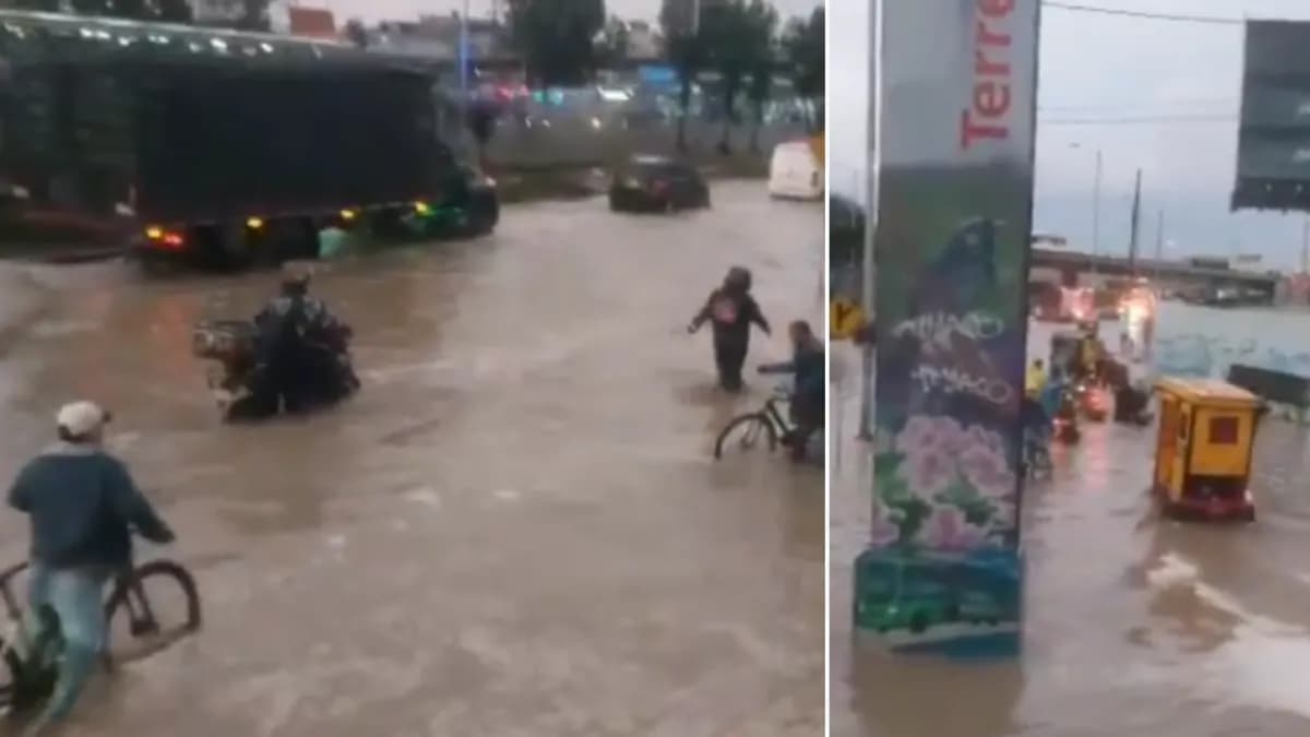 Motociclistas y ciclistas atraviesan la autopista Sur inundada en Soacha