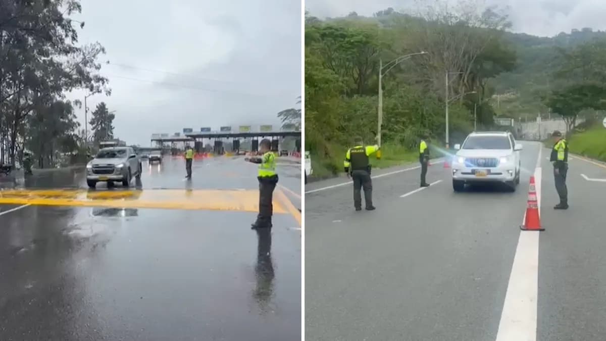 Agentes de la Policía de Tránsito controlan el paso de vehículos en una vía de Antioquia durante el plan retorno