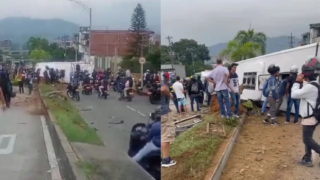 El bus de turismo volcado sobre el separador de la avenida Barranquilla, en Medellín, rodeado de curiosos y motociclistas