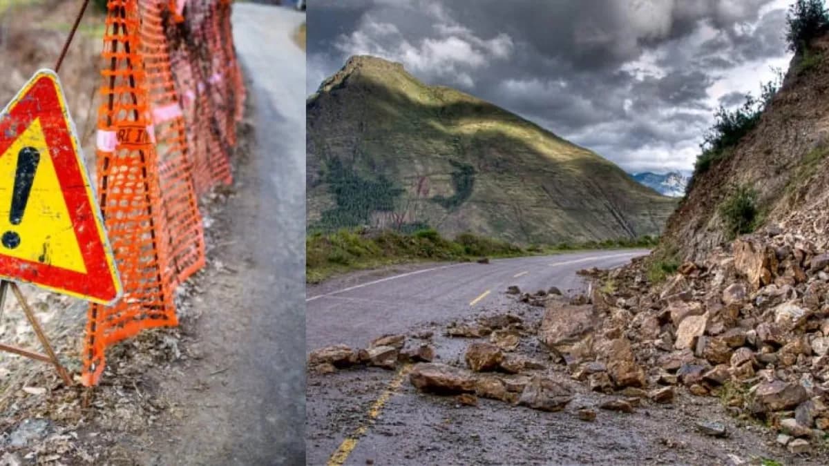 Señal de peligro en una vía y rocas caídas sobre la calzada tras un deslizamiento